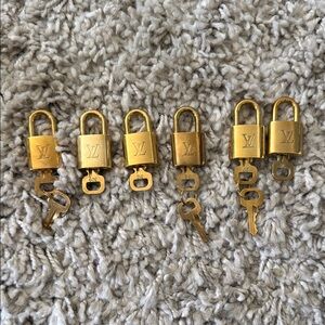 $120 for all Louis Vuitton 6 Gold Padlocks